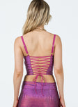 Corset top Sparkly material Adjustable shoulder straps Lace up fastening at back Curved hem 