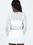Two piece top Sheer lace material Long sleeve top Tie fastening at front Crop top Scooped neckline