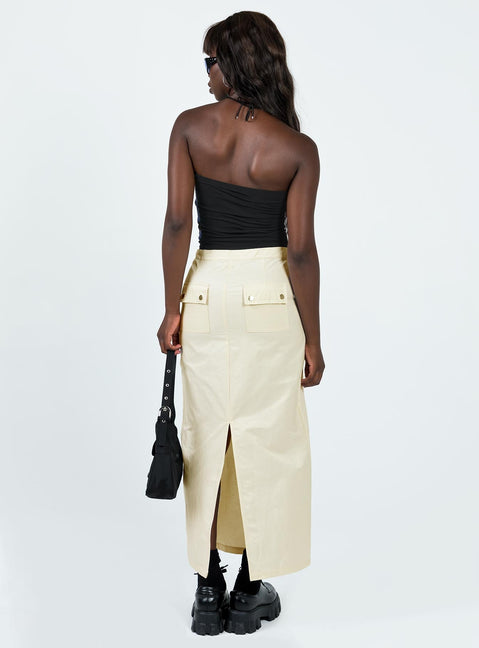 Maxi skirt Mid-low rise Invisible zip fastening at side Twin hip pockets Press button back pockets Drawstring at waist Slit at back