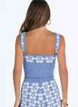 Blue crop top Soft knit material Printed design Square neckline Fixed straps Good stretch Unlined