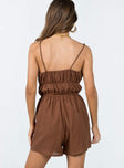 Romper Textured material  Double tie front fastening  Elasticated waist  Twin hip pockets 