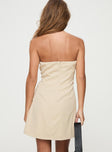 Beige Strapless mini dress Inner silicone strip at bust, twin faux pockets, invisible zip fastening