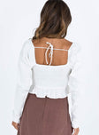White long sleeve top Linen look material Square neckline V wired bust Tie at back of neck Elasticated bands at waist Shirred back Frill hem Ruching at cuffs Good stretch Lined front