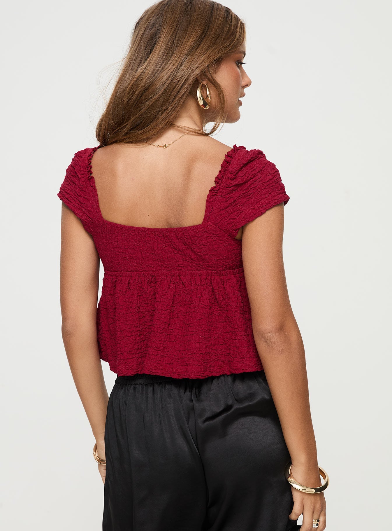v neck top Cap sleeve, textured material, ruffle detail, tie detail at bust, elasticated back