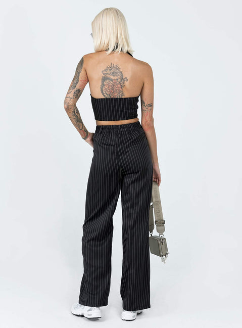 Matching set Pinstripe print  Vest top  Lapel collar  Button front fastening  High waisted pants  Zip & button fastening  Belt looped waist  Twin hip pockets  Elasticated back Wide leg 