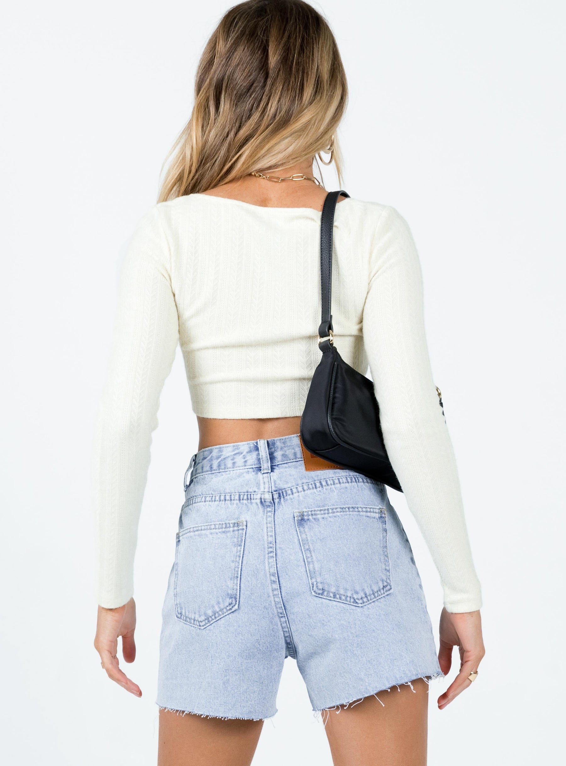 Long sleeve top Spare button included Soft knit material Scoop neckline Button front fastening Good stretch