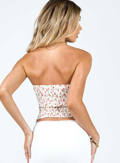 Strapless top Floral print Tie fastening at bust Ruched cups Shirred band at back Good stretch Lined bust