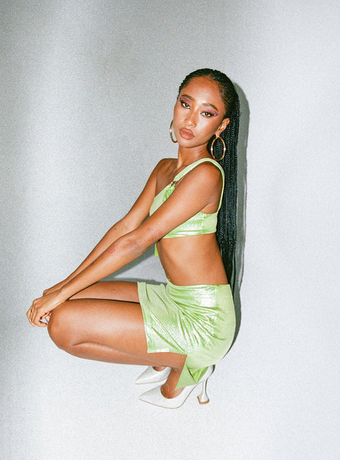 Matching set Sparkly material One shoulder crop top Silver-toned ring Pointed hem Mini skirt Mid-rise V-waist Slit at side Built-in shorts