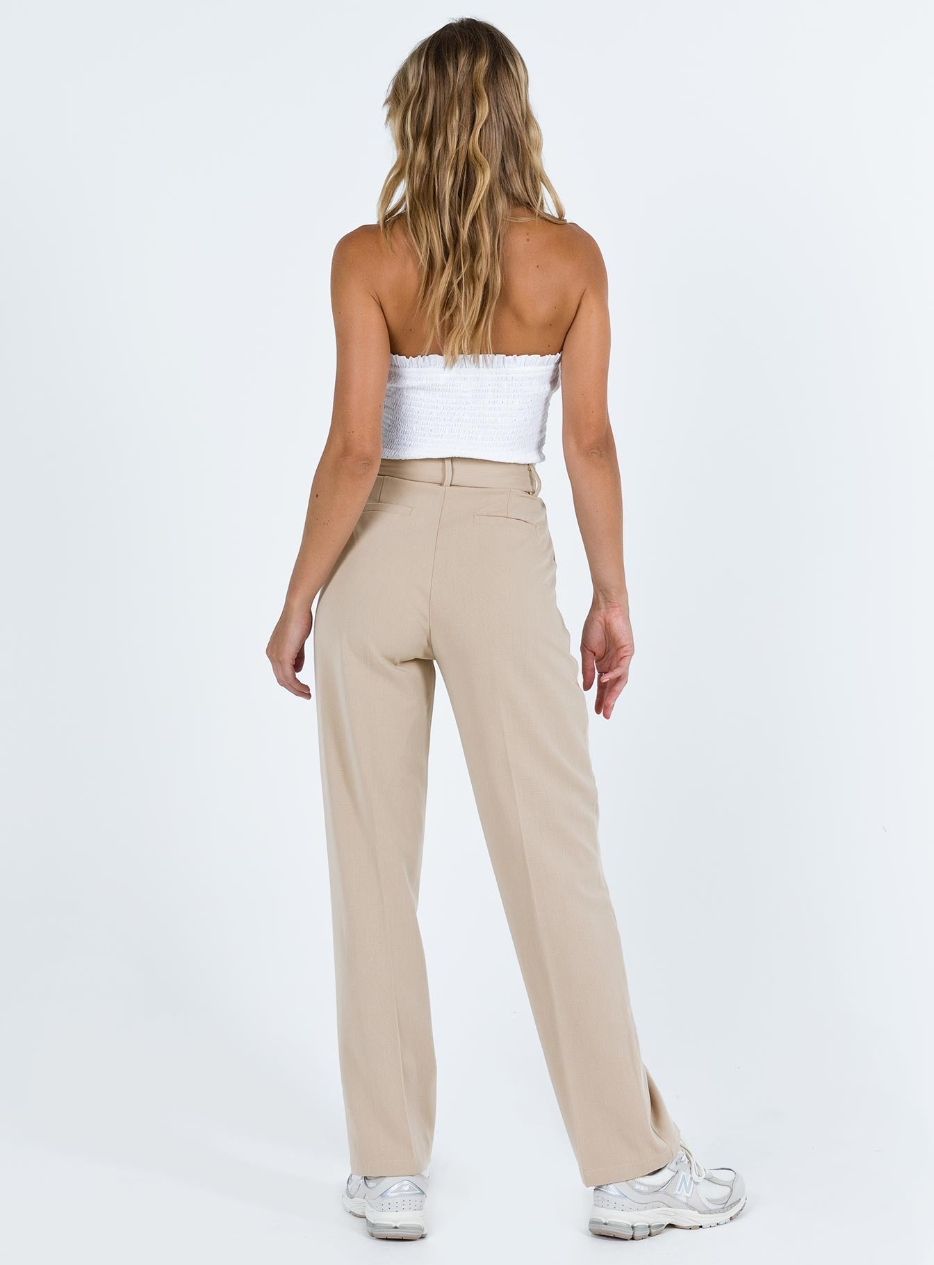 Beige tailored pants High rise Belt looped waist Zip and clasp fastening Stuble pleats at waist Twin hip pockets Straight leg