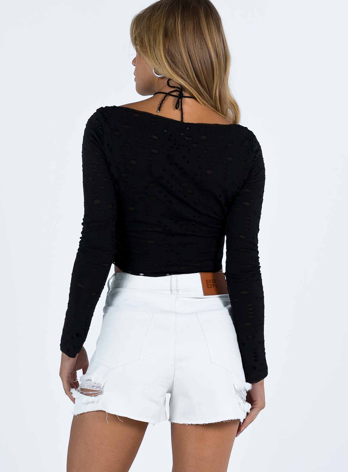 White denim shorts High waisted Belt looped waist Classic five pocket design Button and zip fastening Distressed detail on leg Raw cut hem 