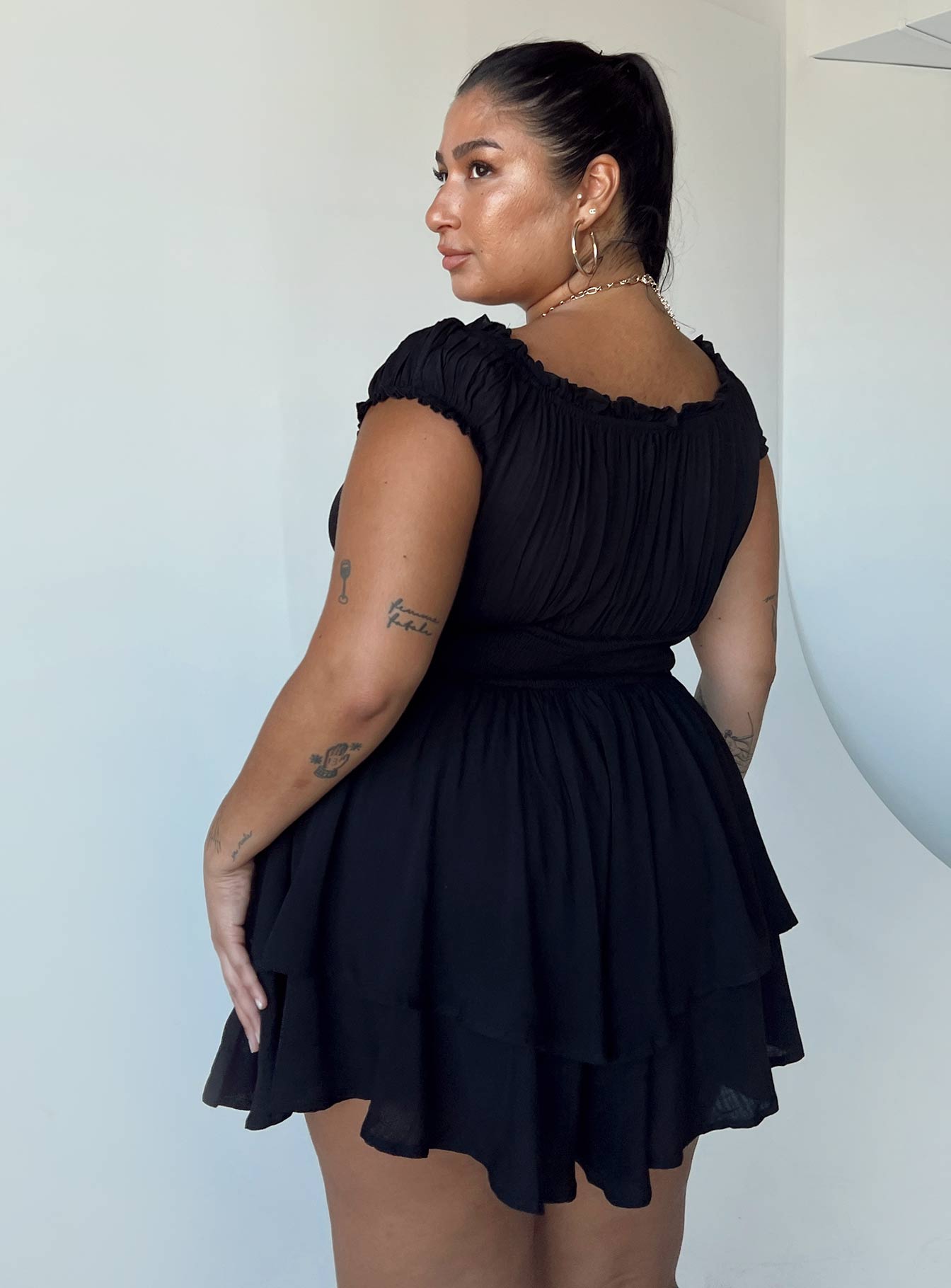 Romper Elasticated shoulders & neckline  Can be worn on or off the shoulder  Gathered bust  Boning through waist  Shirred back panel  Layered bottom 