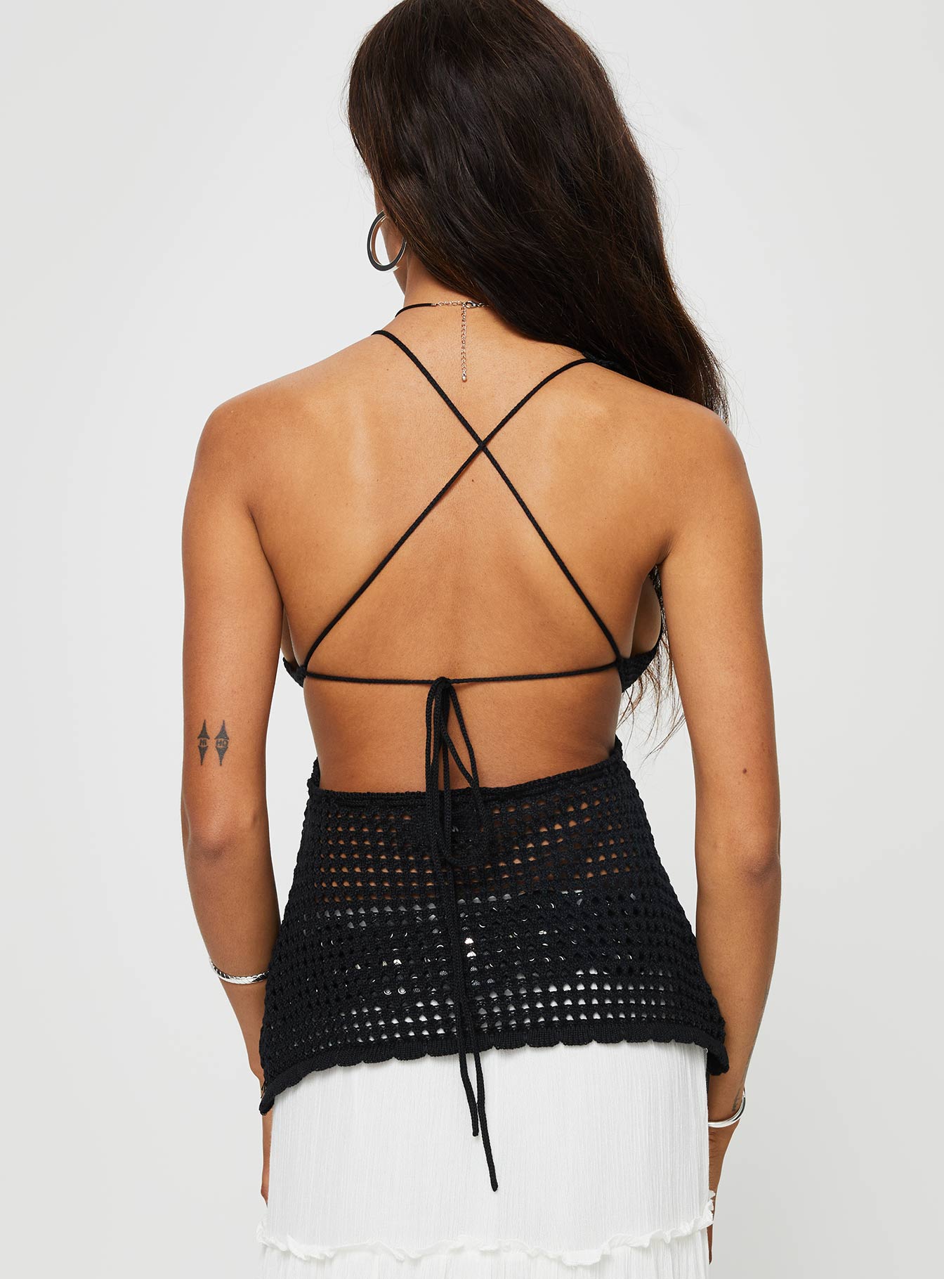 Crochet halter top Tie fastening at bust, cross over back straps with tie fastening Slight stretch, unlined, sheer