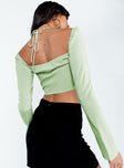 Green long sleeve top Sheer material  Elasticated shoulders  Gathered bust  Wired cups  Tie fastening at bust  Flared sleeves 