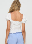 White Puff sleeve, v-neckline, pleats at front, button fastening down front, lace trim, fril hem