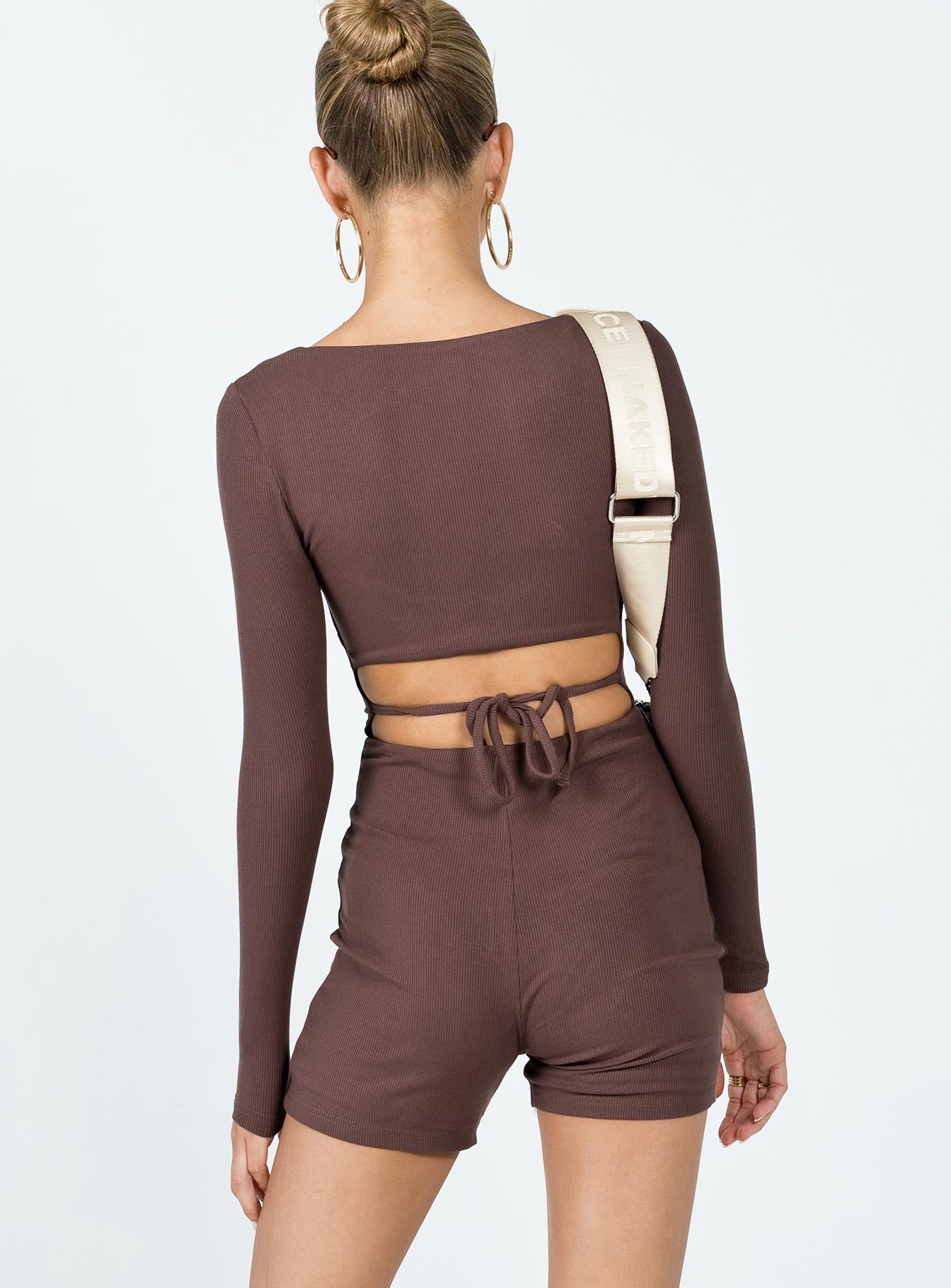 Romper Ribbed material  Square neckline  Cut out back  Tie fastening at back 