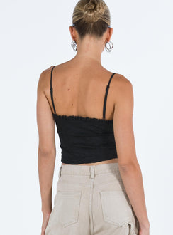 Crop top Lace material  Ruffle neckline  Adjustable shoulder straps  Inner silicone strip at bust  Lace up fastening at front Non stretch Fully lined 