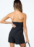 Strapless black romper Pinstripe print Folded neckline Inner silicone strip at bust Invisible zip fastening at back Twin hip pockets