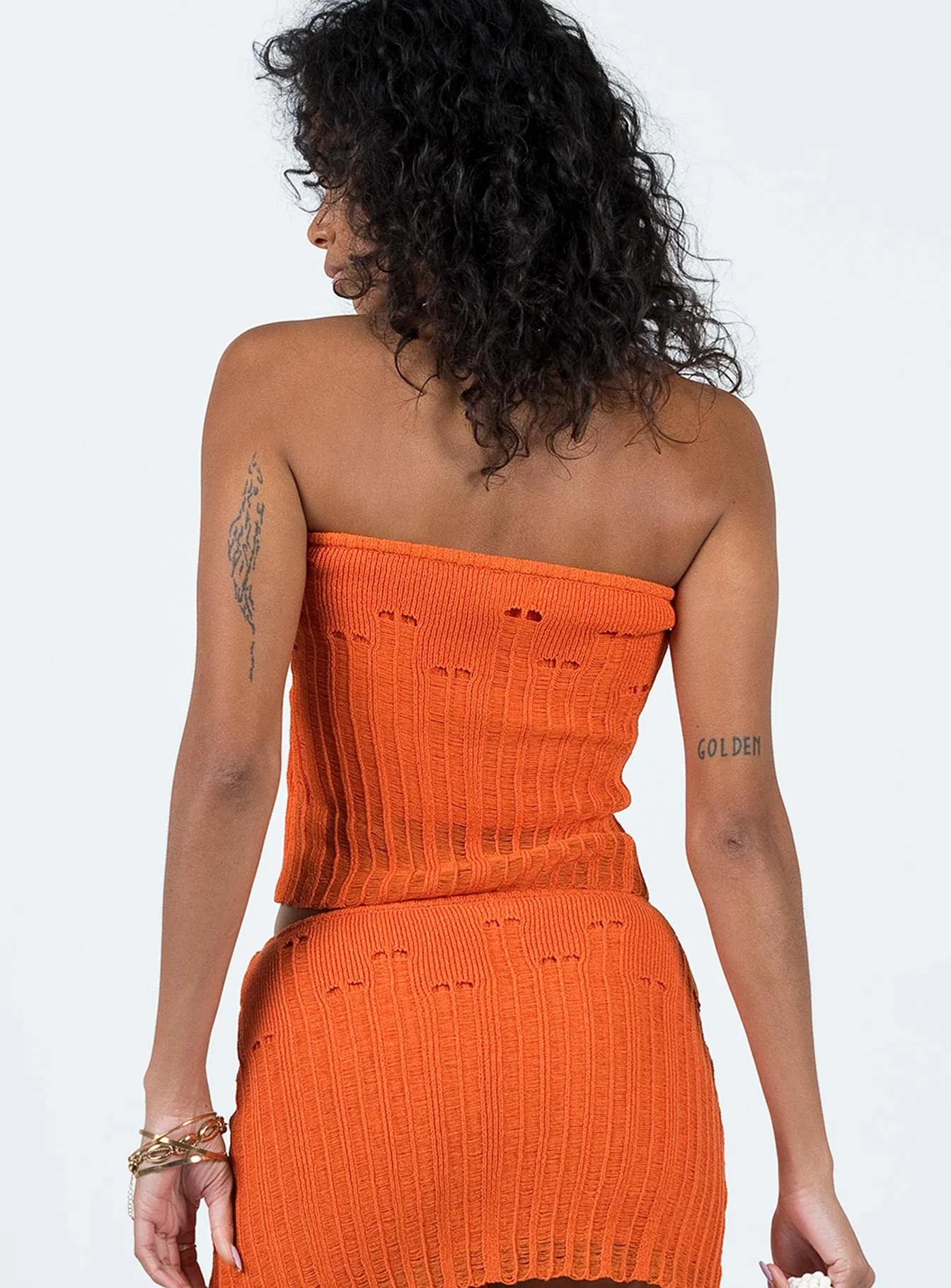 Tube top Knit material Distressed detail Good stretch 