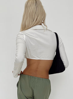 White long sleeve top Classic collar Plunging neckline Tie fastening at waist Flared cuff