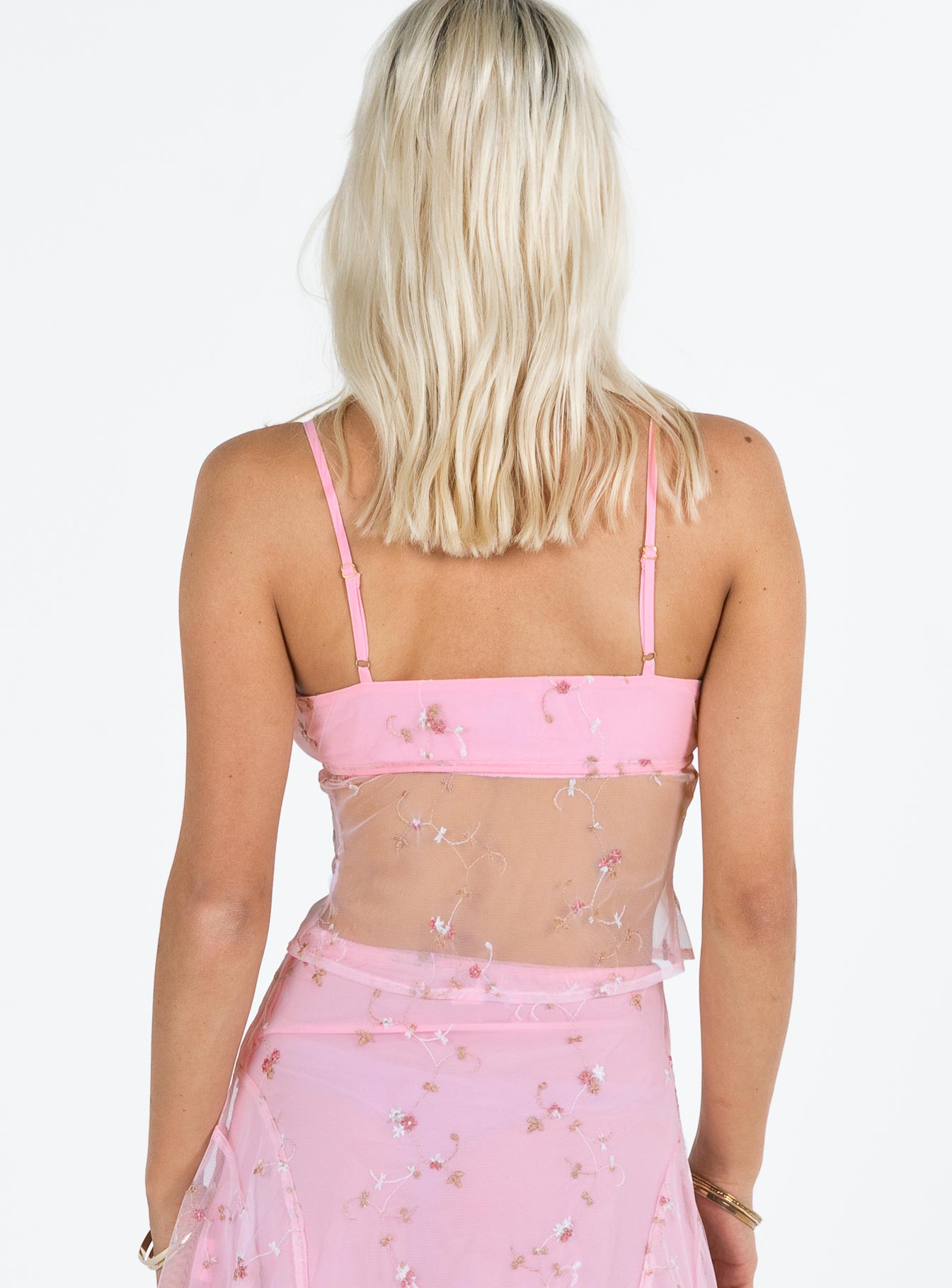Pink top Sheer mesh material Floral embellishments Adjustable shoulder straps Open front Tie fastening at bust