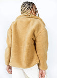 Beige jacket Faux fur material Zip front fastening Twin front pockets