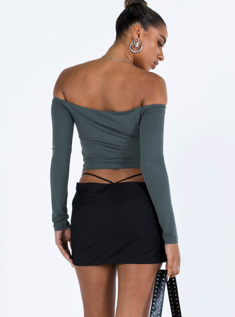 Black mini skirt Low rise Asymmetric waist Tie fastening at waist Invisible zip fastening at side