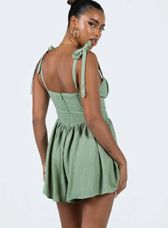 Romper Adjustable shoulder straps with tie fastening  Ruched bust Invisible zip fastening at back Slight ruching at waist