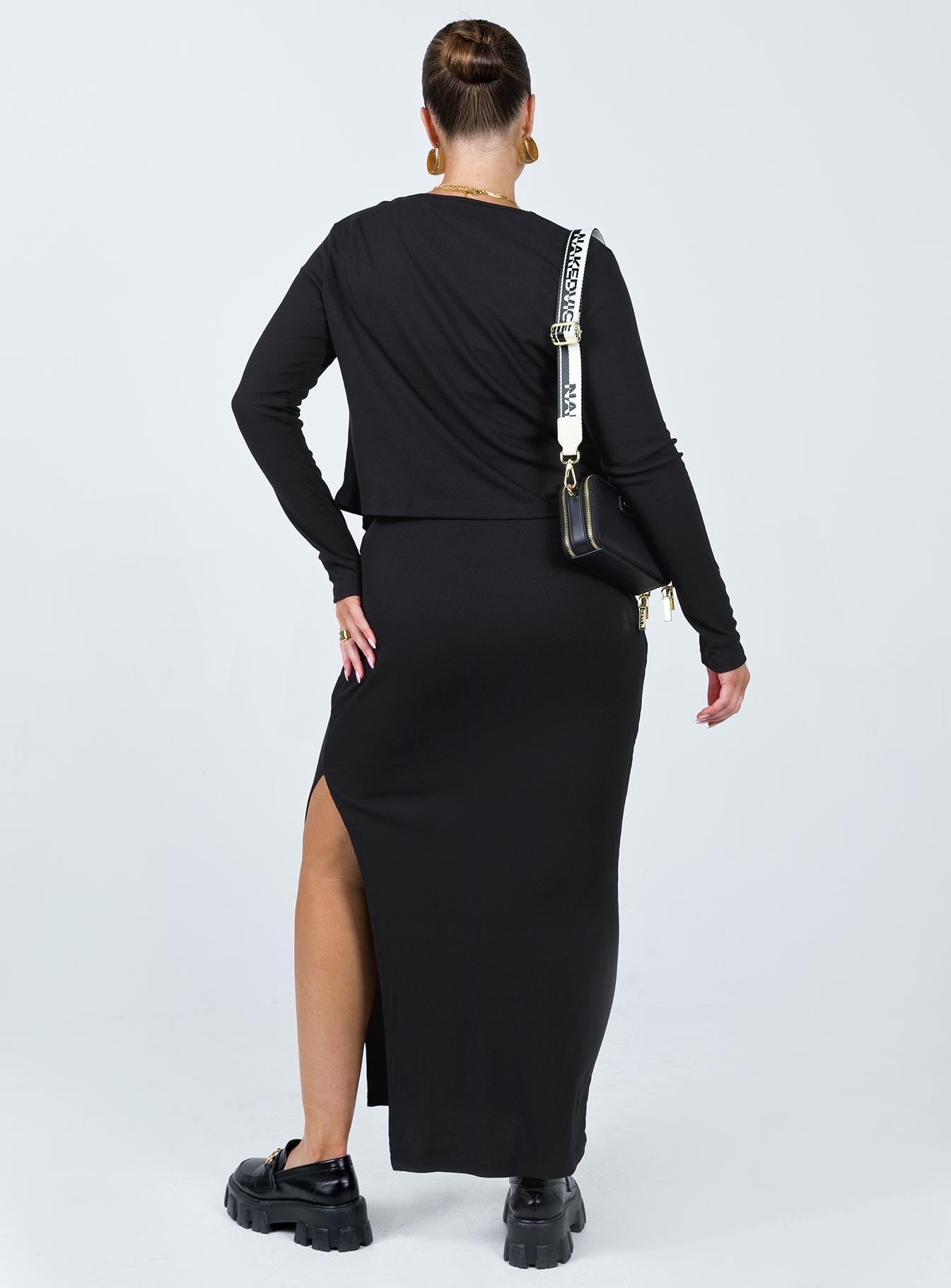 Matching three piece set Ribbed material Long sleeve cardigan  Button fastening at front Crop top Scoop neckline Adjustable shoulder straps Midi skirt Elasticated waistband Slit at side