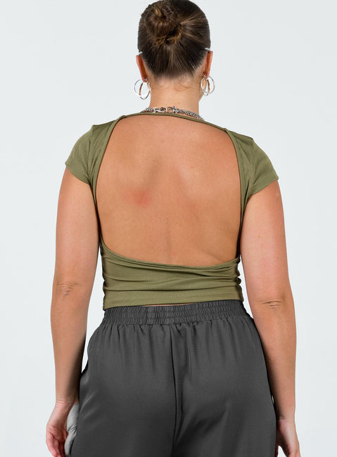 Crop top Ribbed material Large cut out at back Cap sleeve Good stretch