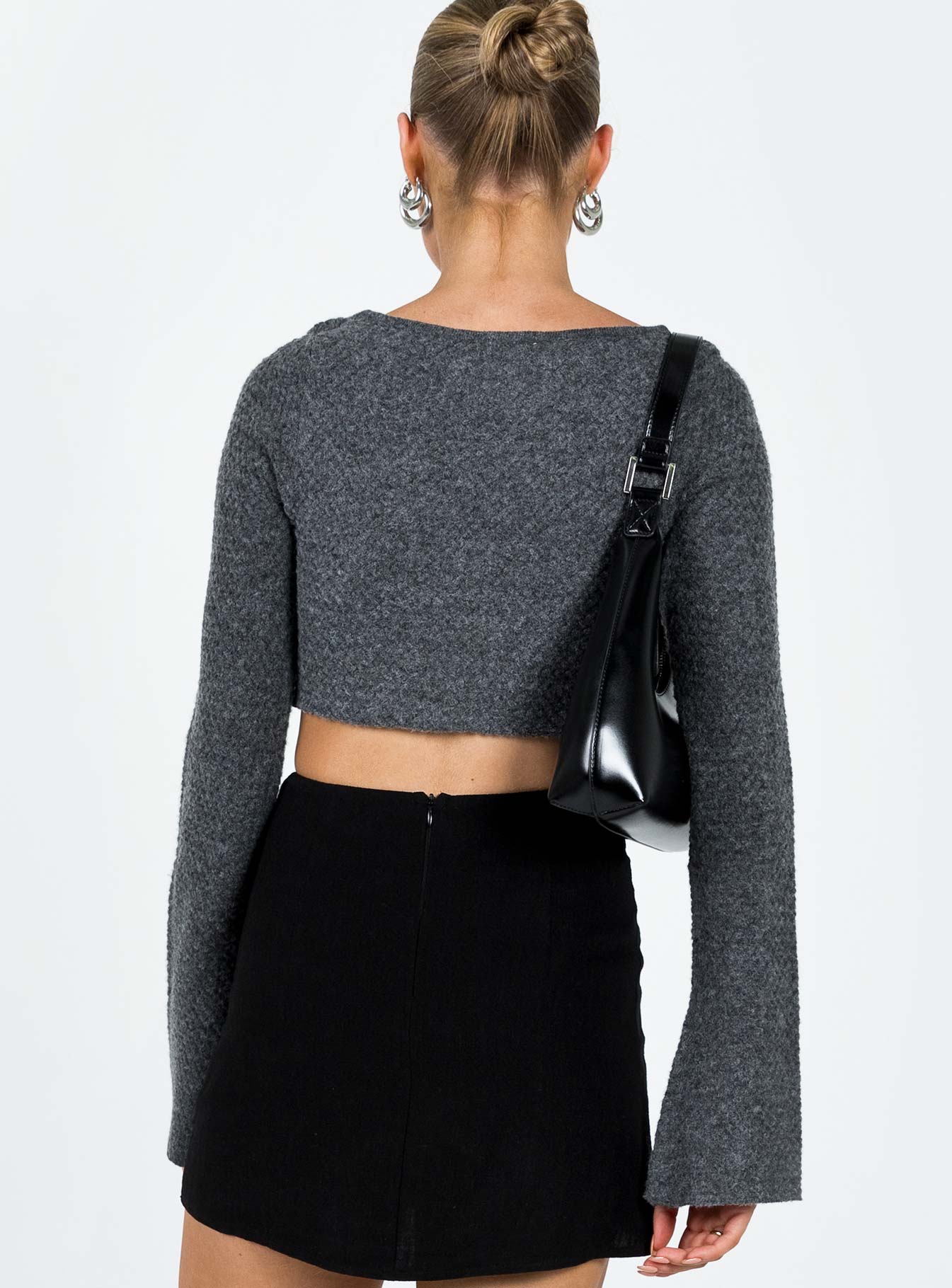 Bolero Knit material V neckline Tie fastening at bust Flared sleeve  Good stretch Unlined 