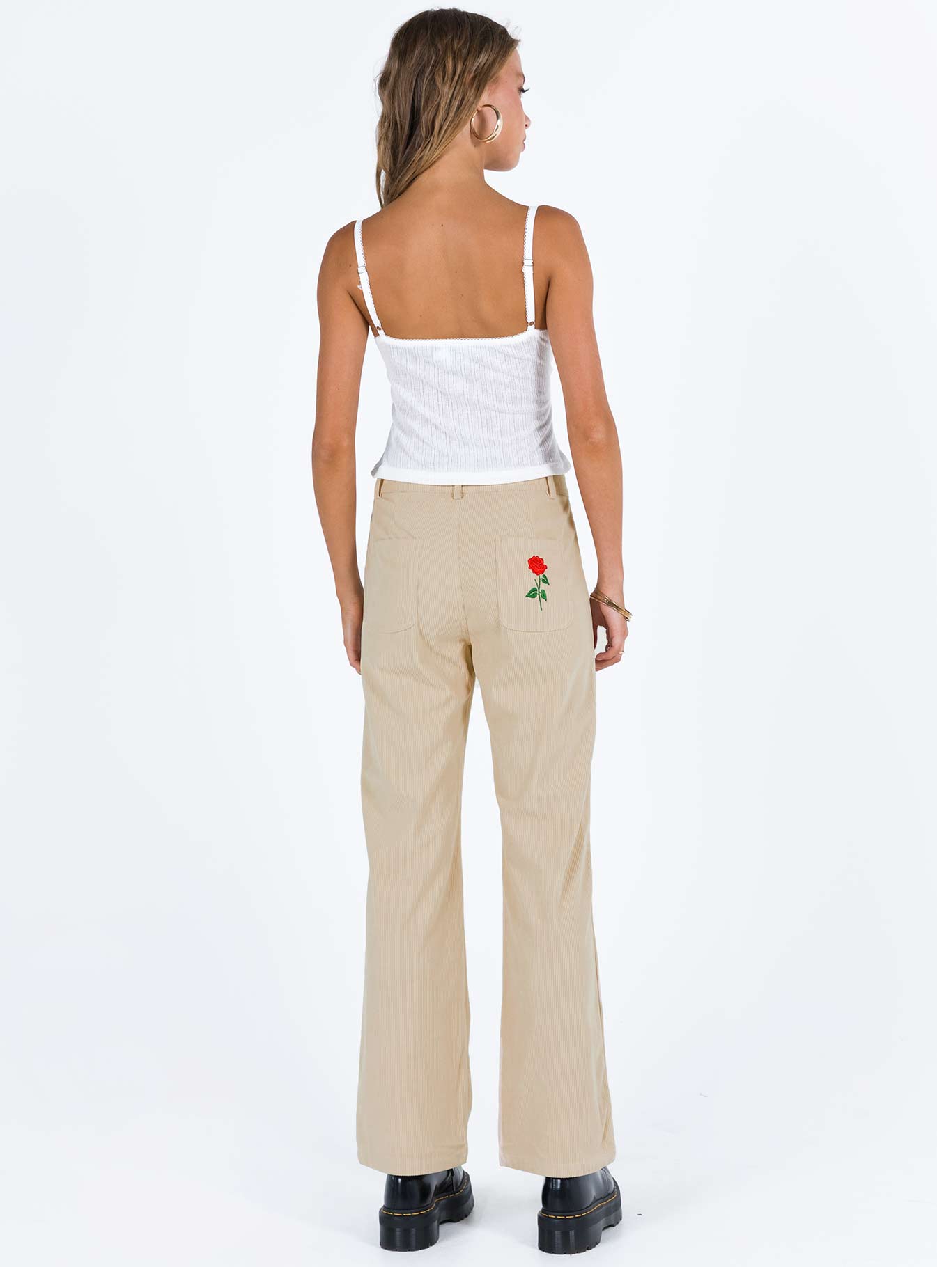 Beige pants Corduroy material Belt looped waist Zip and button fastening Classic five-pocket design Embroidered design at back Straight leg