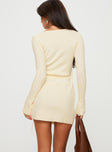 Long sleeve mini dress, knit material Wrap design with tie fastening at side, slightly flared cuff Good stretch, unlined 