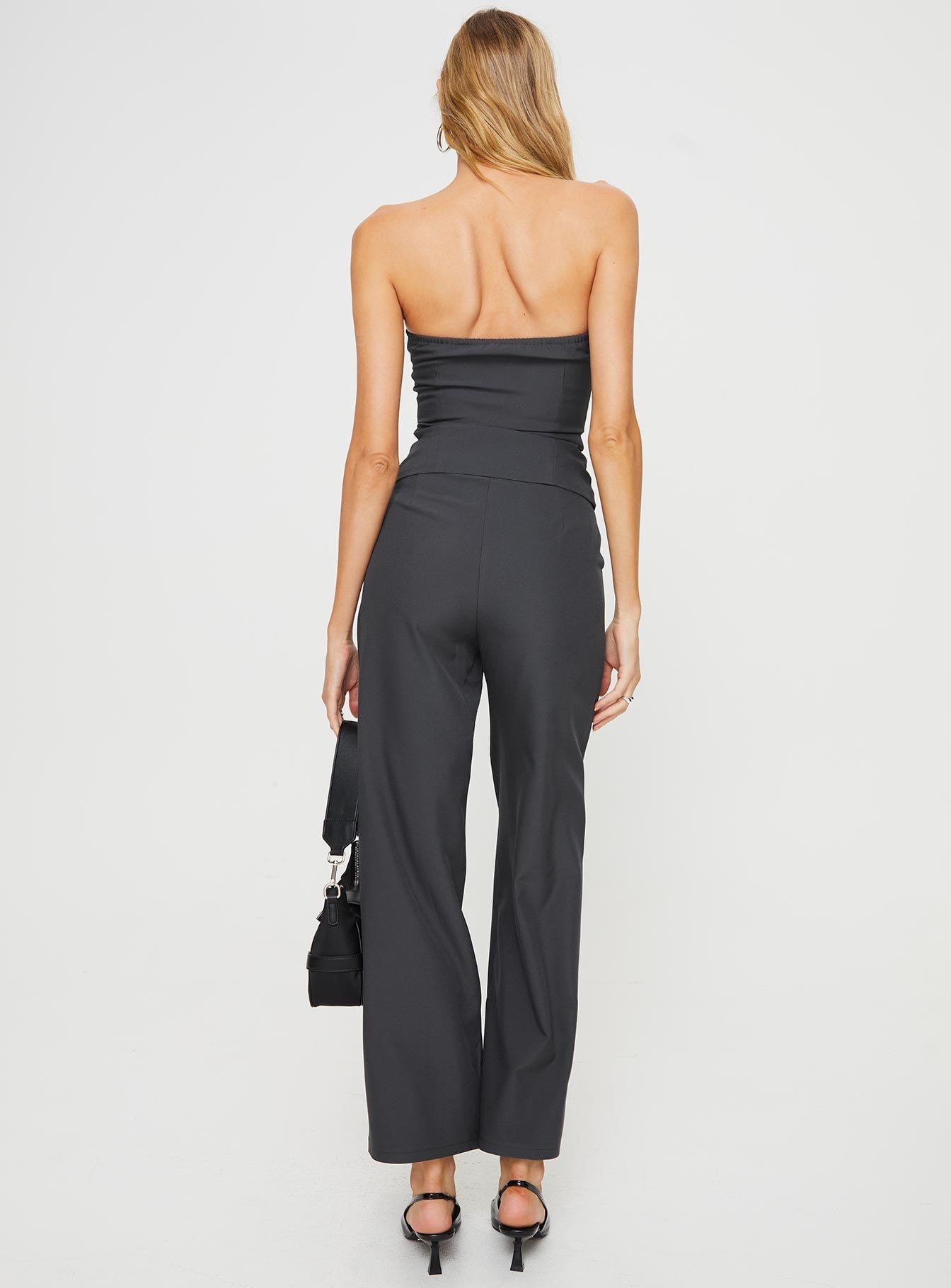 Matching set  Strapless slim-fitting top, faux front pockets, split hem Elasticated at back, silicone inner strip at bust, front button fastening Non-stretch, fully lined top High-waisted straight-leg pants, subtle pleats at the waist, twin hip pockets  Zip & button fastening Non-stretch, unlined  Princess Polly Lower Impact