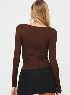 Long sleeve top V-neckline, twist detail at bust, split hem Good stretch, lined front
