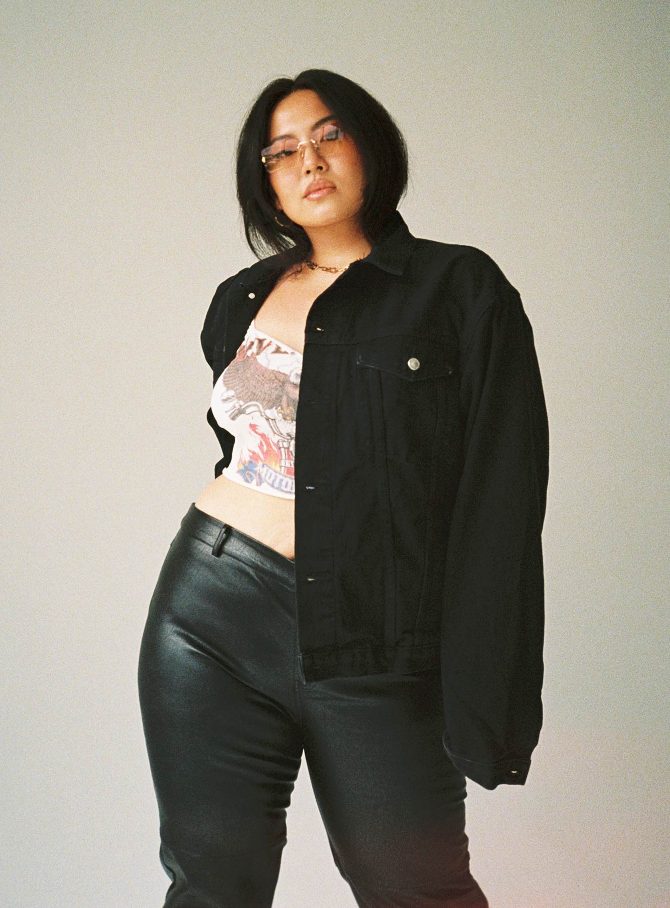 Oversized black denim jacket Button front fastening Four pocket design Single-button cuff Silver buttons