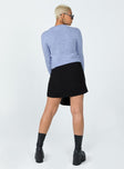 Sweater 97% recycled post consumer polyester 3% conventional elastane Soft knit material High neckline  Asymmetric button front fastening  Ribbed waistband & cuffs 
