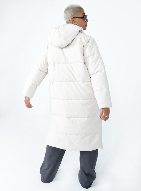 Longline puffer jacket Drawstring hood  Zip front fastening  Twin hip pockets  Press button fastening down sides  Fully lined 