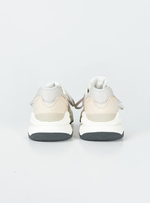 Sneakers  Faux suede & leather material  Lace-up style  Platform base Padded inner  Treaded sole 