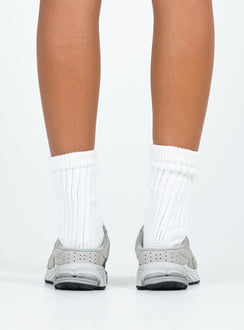 Faux suede sneakers, slip-on style Padded footbed, mesh netting detail, treaded sole