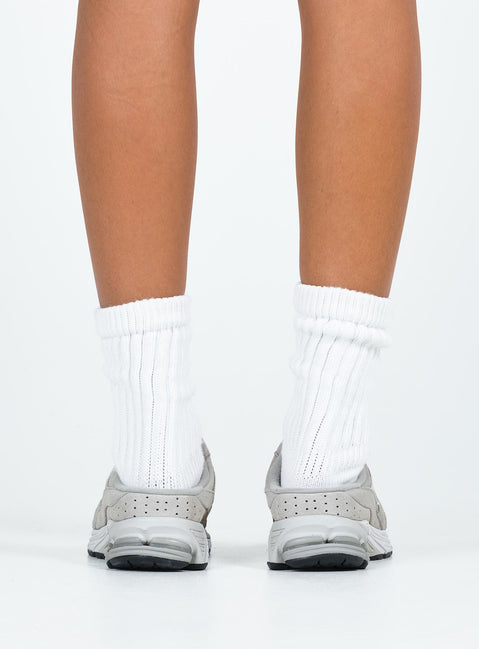 Faux suede sneakers, slip-on style Padded footbed, mesh netting detail, treaded sole