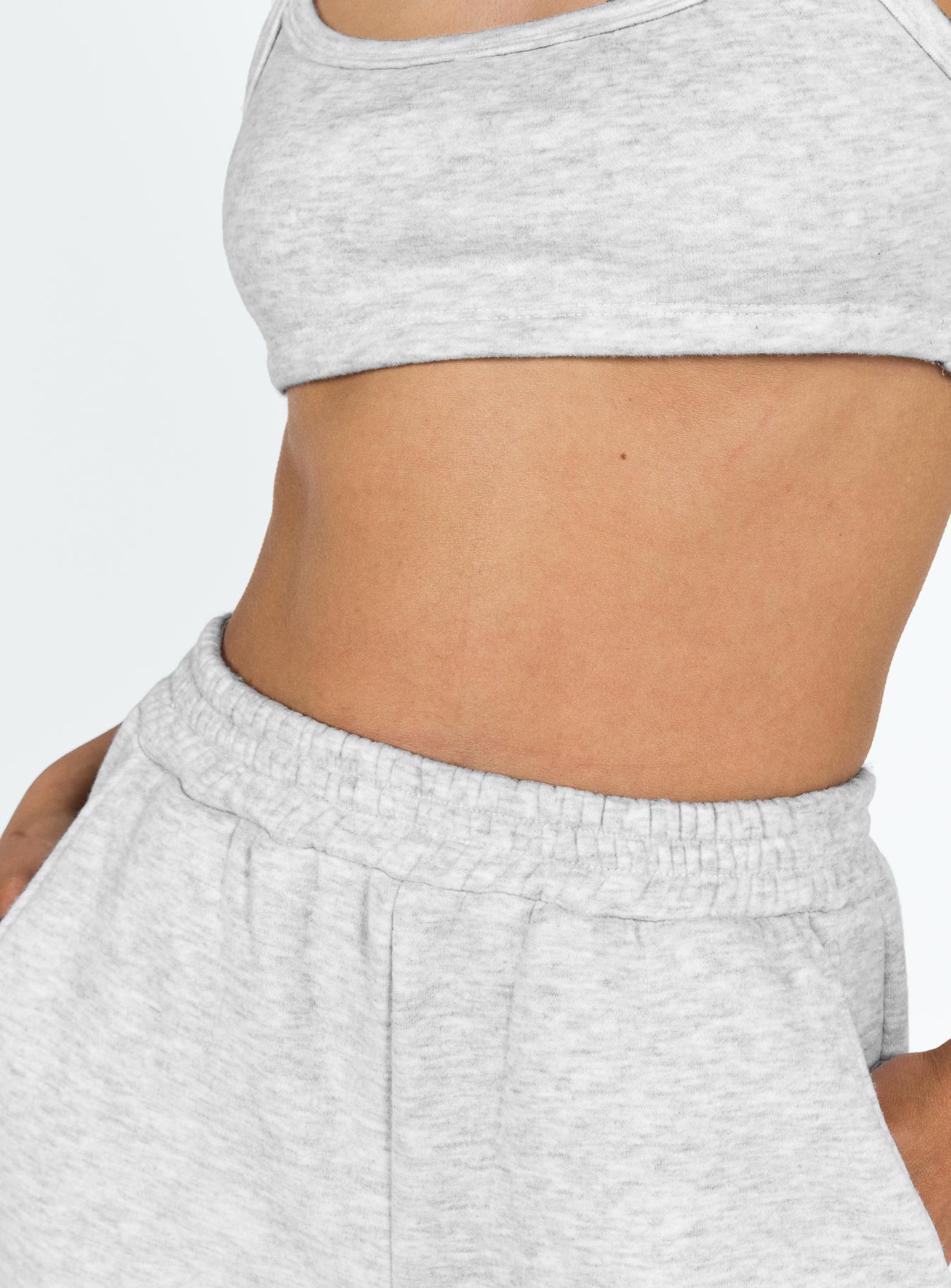 Matching set Crop top Fixed shoulder straps Scooped neckline Invisible zip fastening at side Track pants High rise Elasticated waistband Twin hip pockets Straight leg Extra cargo style leg pockets Elasticated cuff