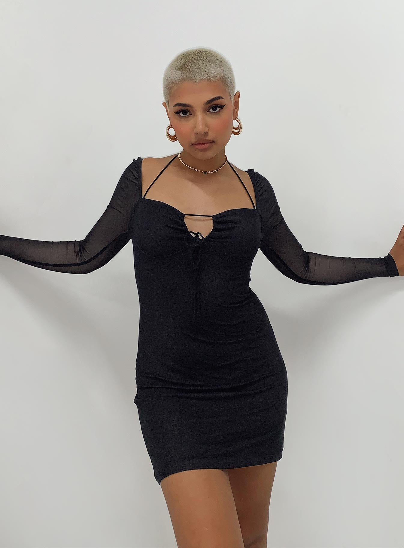 Long sleeve mini dress Sheer mesh sleeves  Halter neck tie fastening  Adjustable tie at bust 