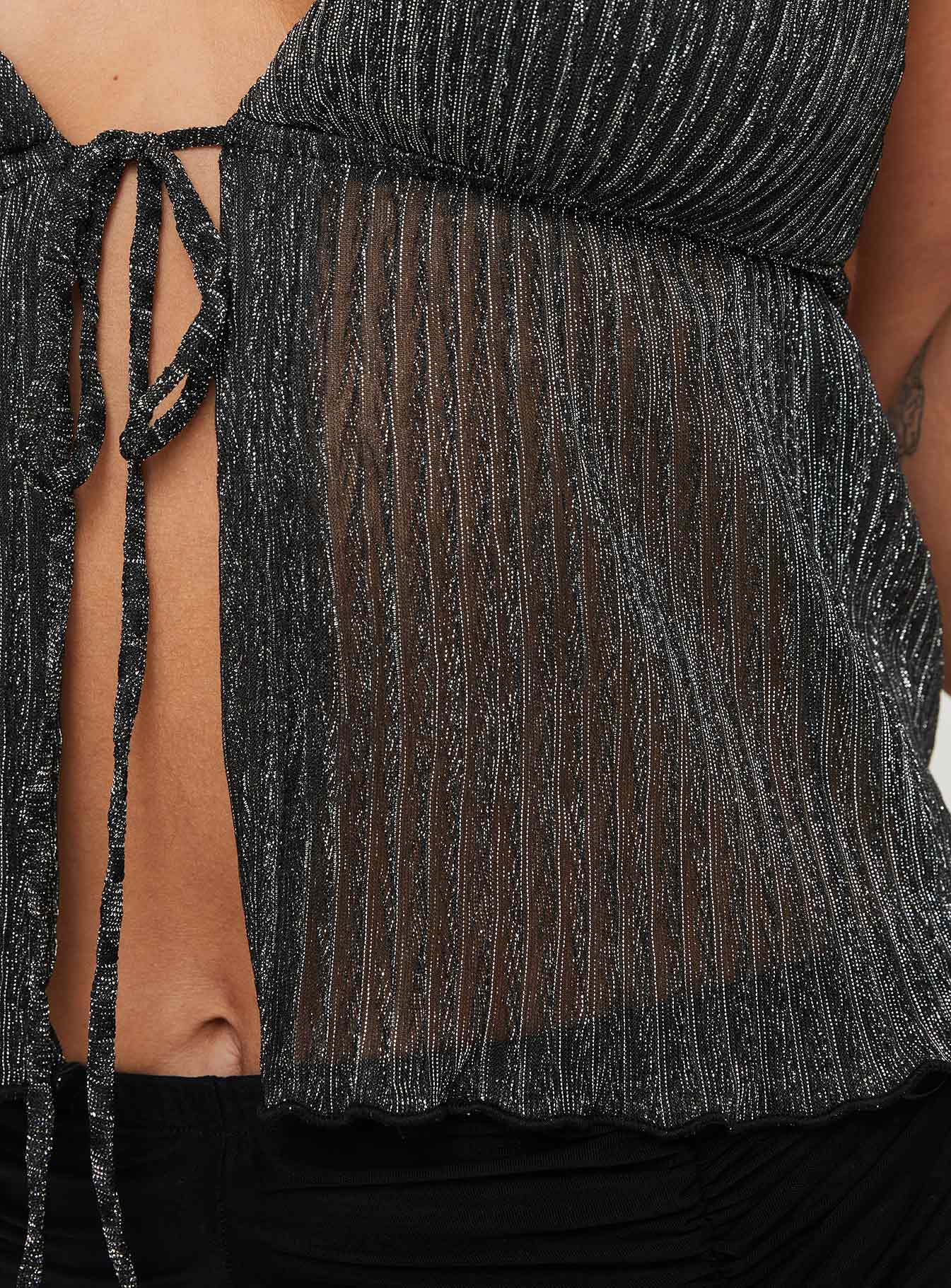 Plisse glitter top Sheer material, plunging neckline, split hem, halter neck tie, tie fastening at bust Good stretch, lined bust