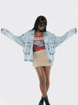 Oversized light wash denim jacket  Classic collar, drop shoulder, button fastening at front, oversized chest pocket, single button cuff