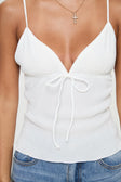 White Camisole top Plisse material, adjustable straps, tie fastening at bust, lettuce edge hem