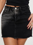 Denim mini skirt A-line style, classic five pocket design, zip and button fastening, belt loops at waist, raw edge hem, branded patch at back