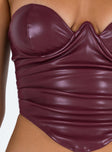 Bustier Faux leather material Inner silicone strip at bust Wired cups Zip fastening at back Pleats at side Pointed hem
