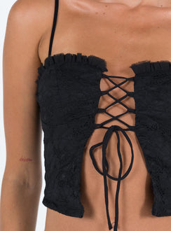 Crop top Lace material  Ruffle neckline  Adjustable shoulder straps  Inner silicone strip at bust  Lace up fastening at front Non stretch Fully lined 