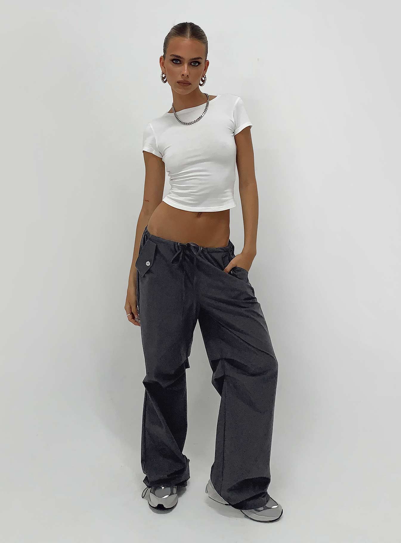 Parachute pants Elasticated drawstring waist Twin hip pockets Silver toned hardware Pleats at inner leg Wide leg Drawstring ankle 