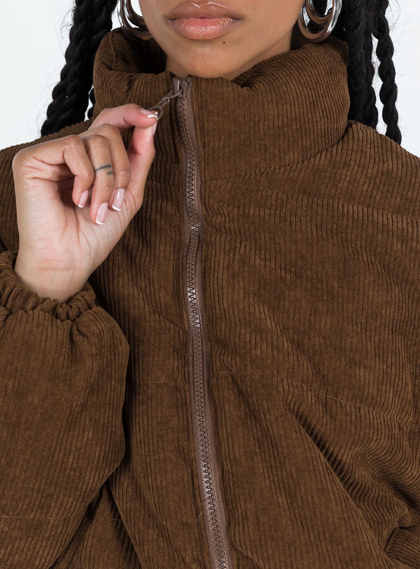 Relaxed fit brown puffer jacket Corduroy High neck Zip front fastening Twin zip front pockets Ribbed cuffs Elasticated waist